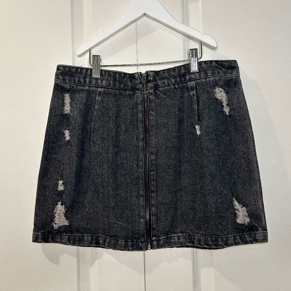 Slightly distressed dark wash zip-up jean skirt size L